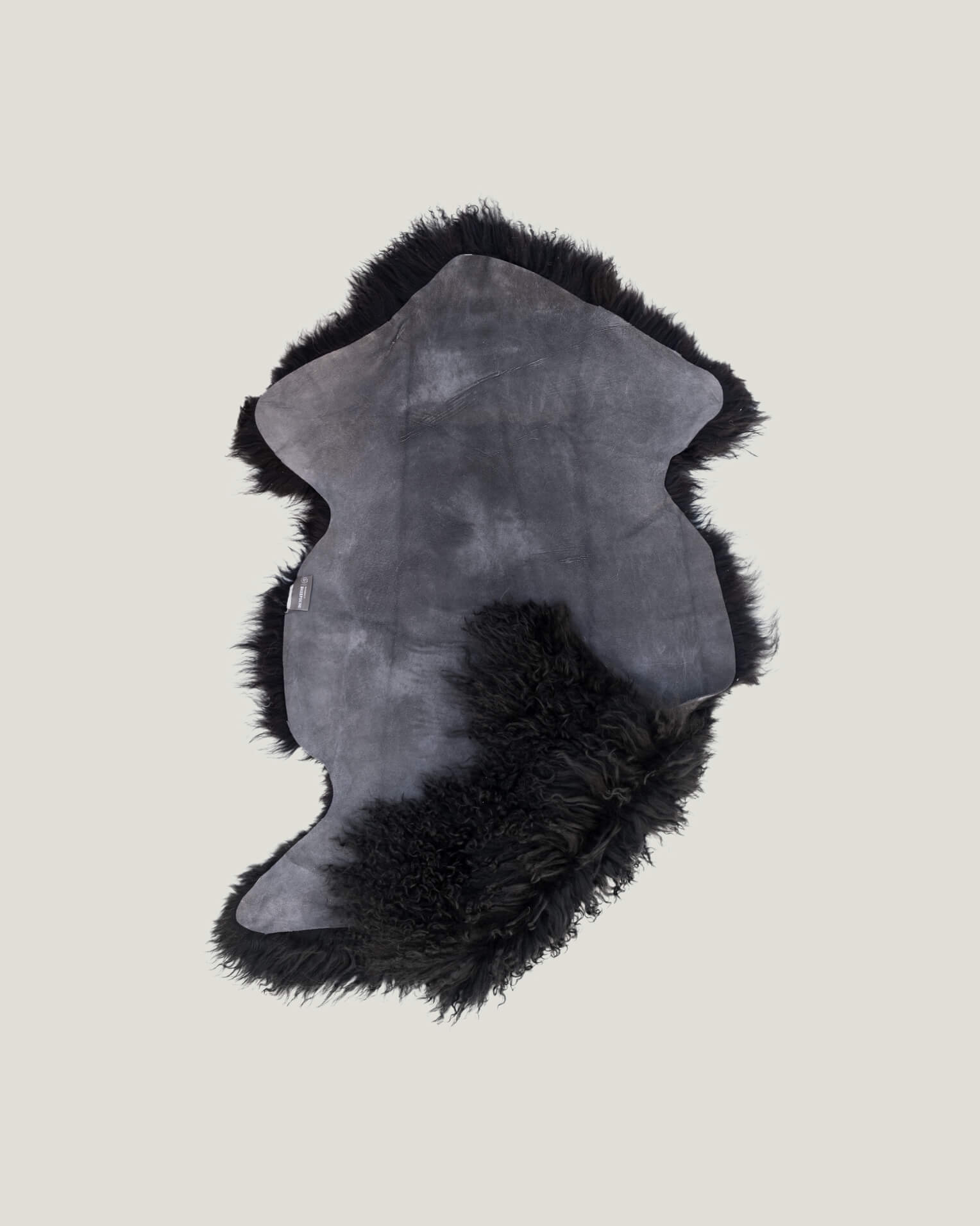 Black Mongolian Sheepskin Rug back