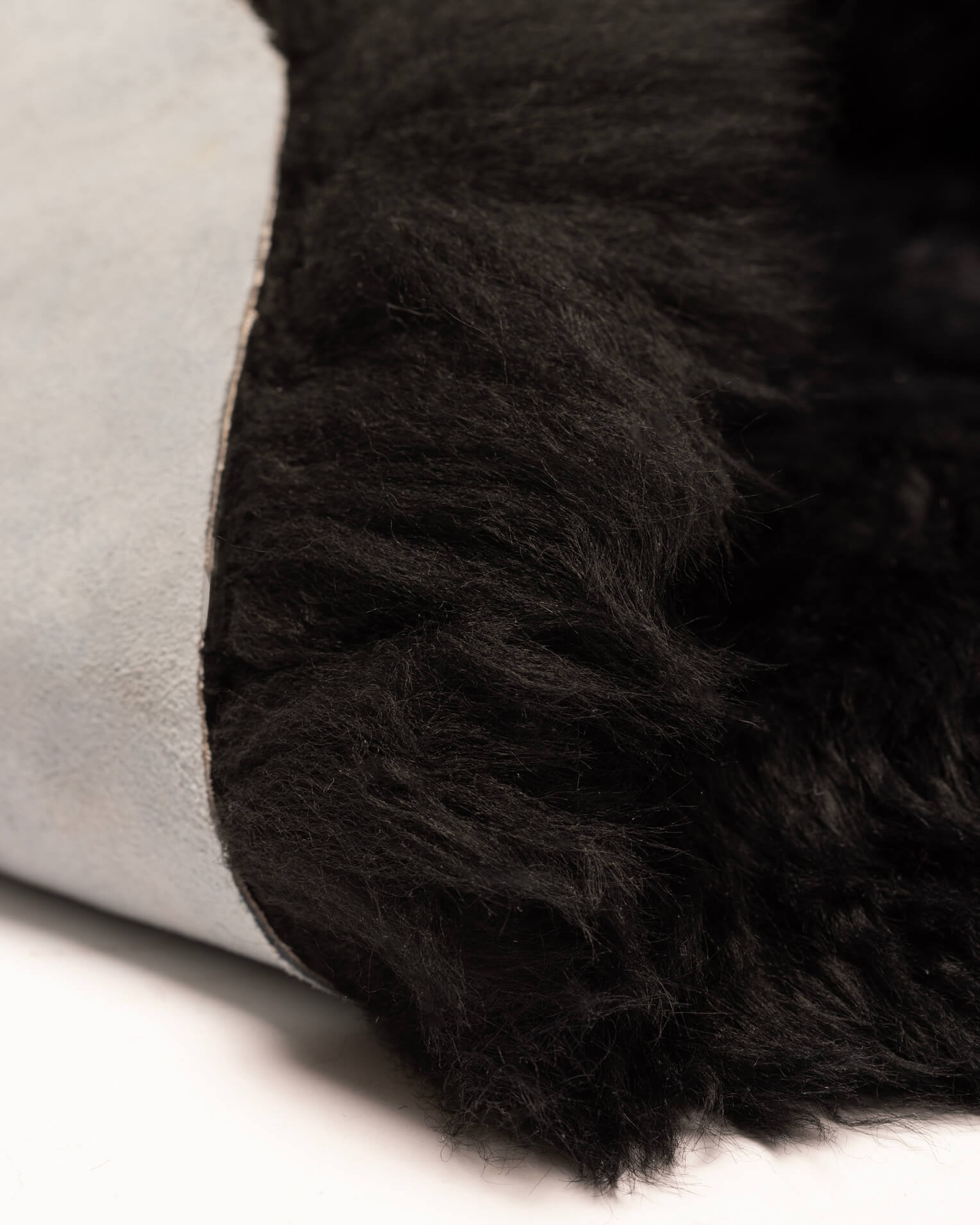 Black Double Long Wool Sheepskin Rug close up