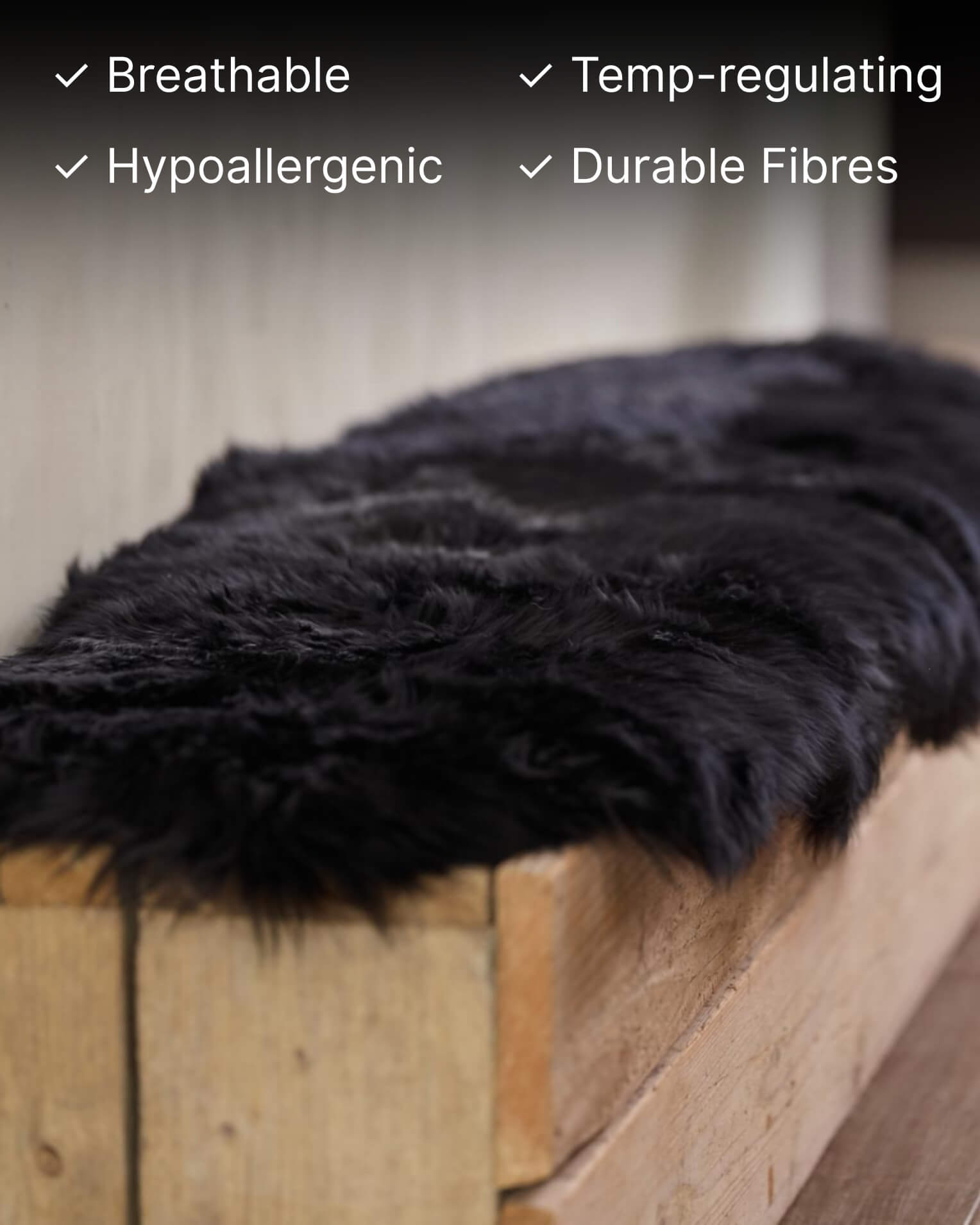 Black Double Long Wool Sheepskin Rug on bench close up