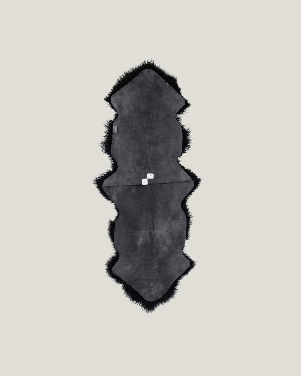 Black Mongolian Sheepskin Rug back