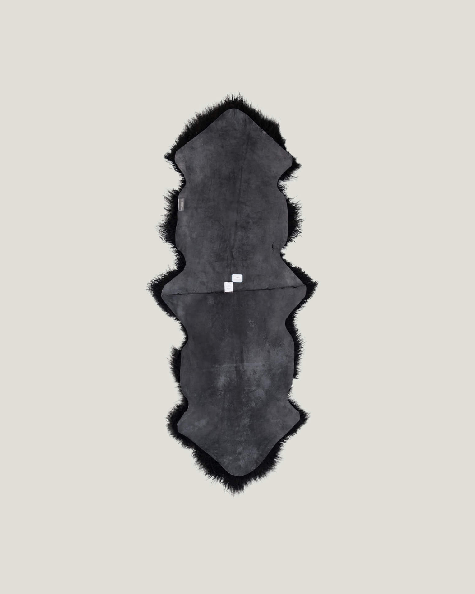 Black Mongolian Sheepskin Rug back