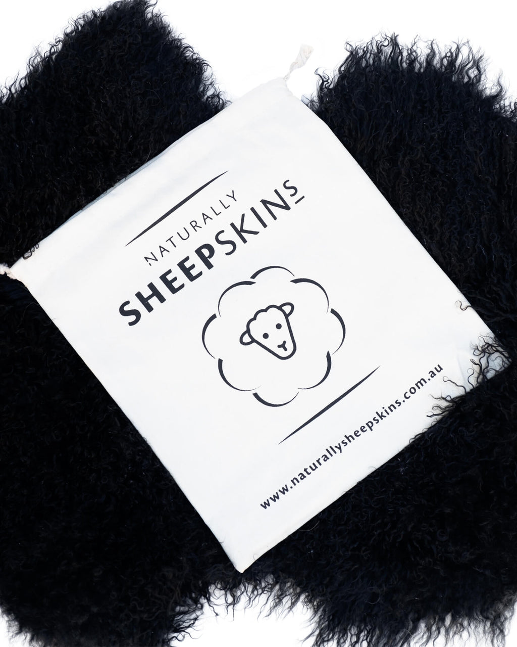 Canvas bag on Black Mongolian Sheepskin Rug