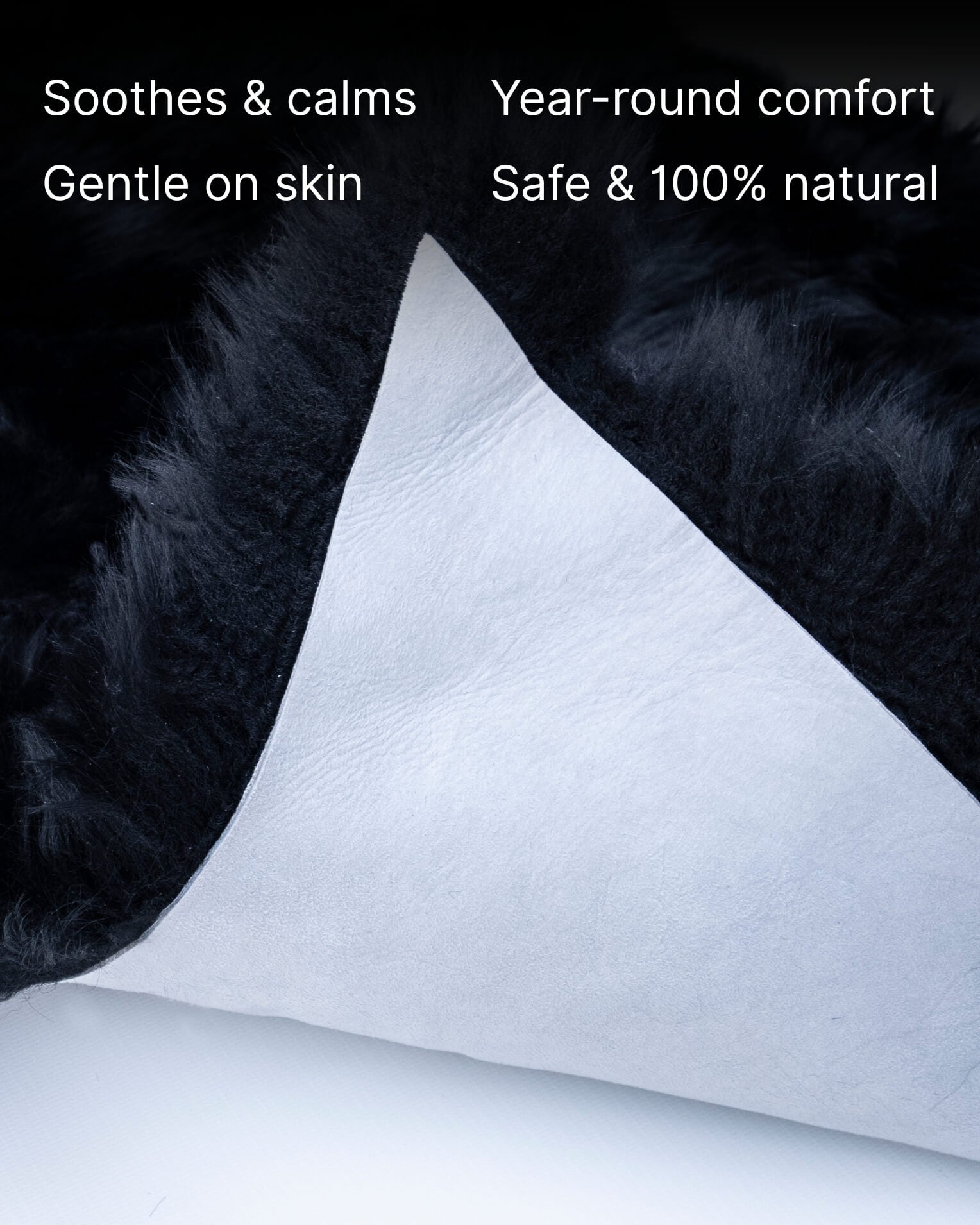 Black Single Sheepskin rug folded close up