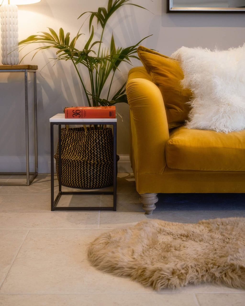 Bronze Double Long Wool Sheepskin Rug front of sofa