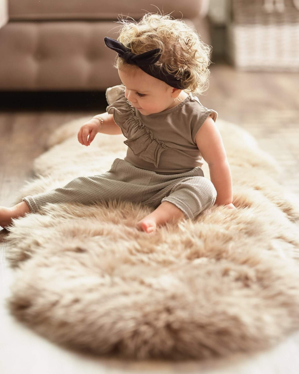 Baby playing on Bronze Double Long Wool Sheepskin Rug 