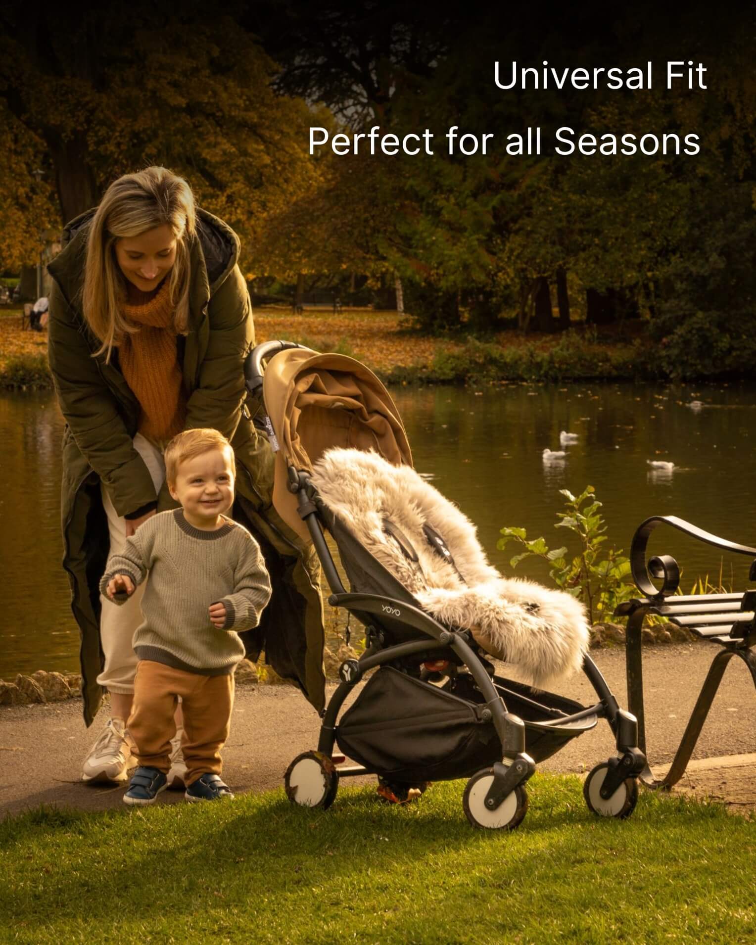 Woman pushing a stroller with a child in a park