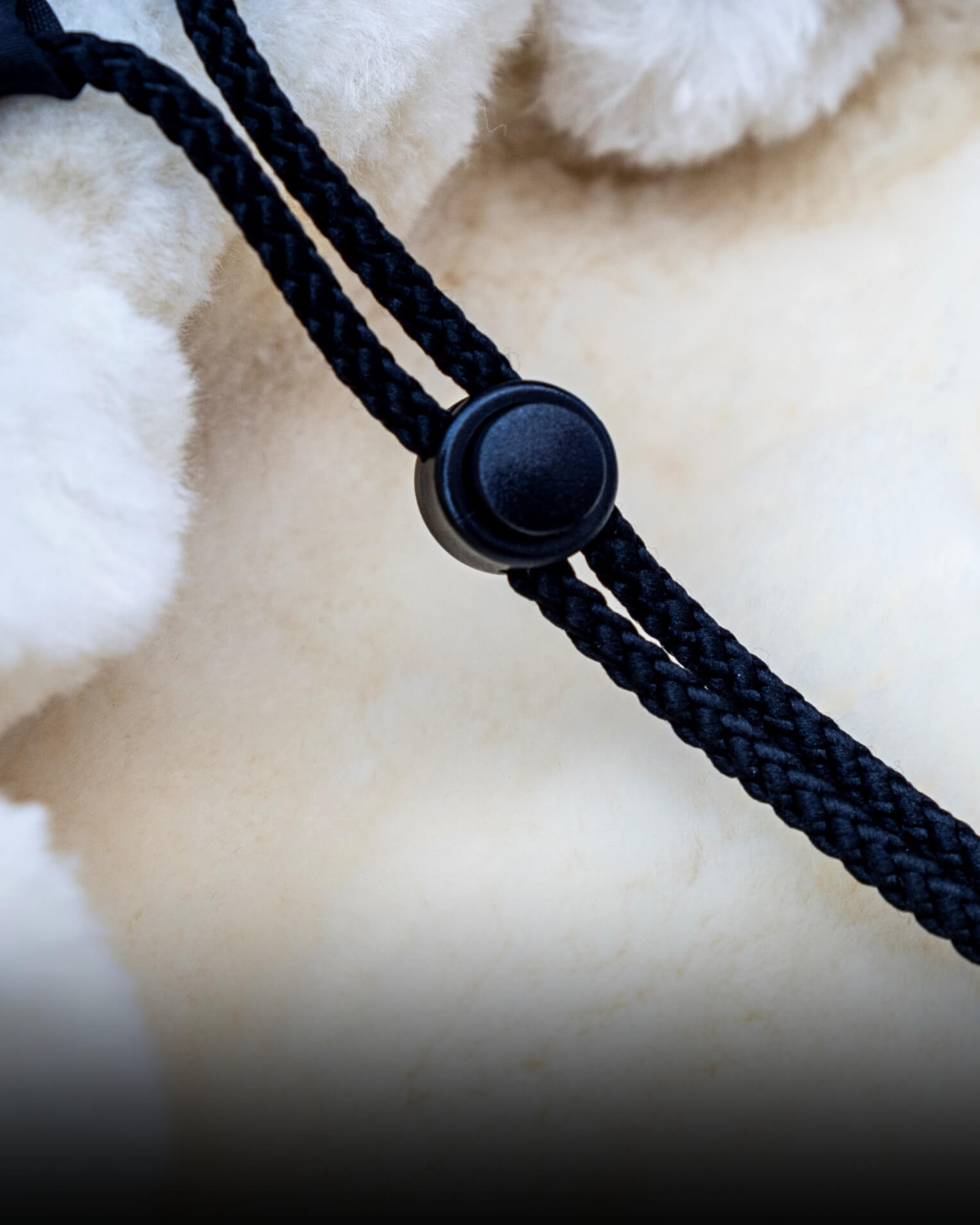 Close-up of footmuffs black cord