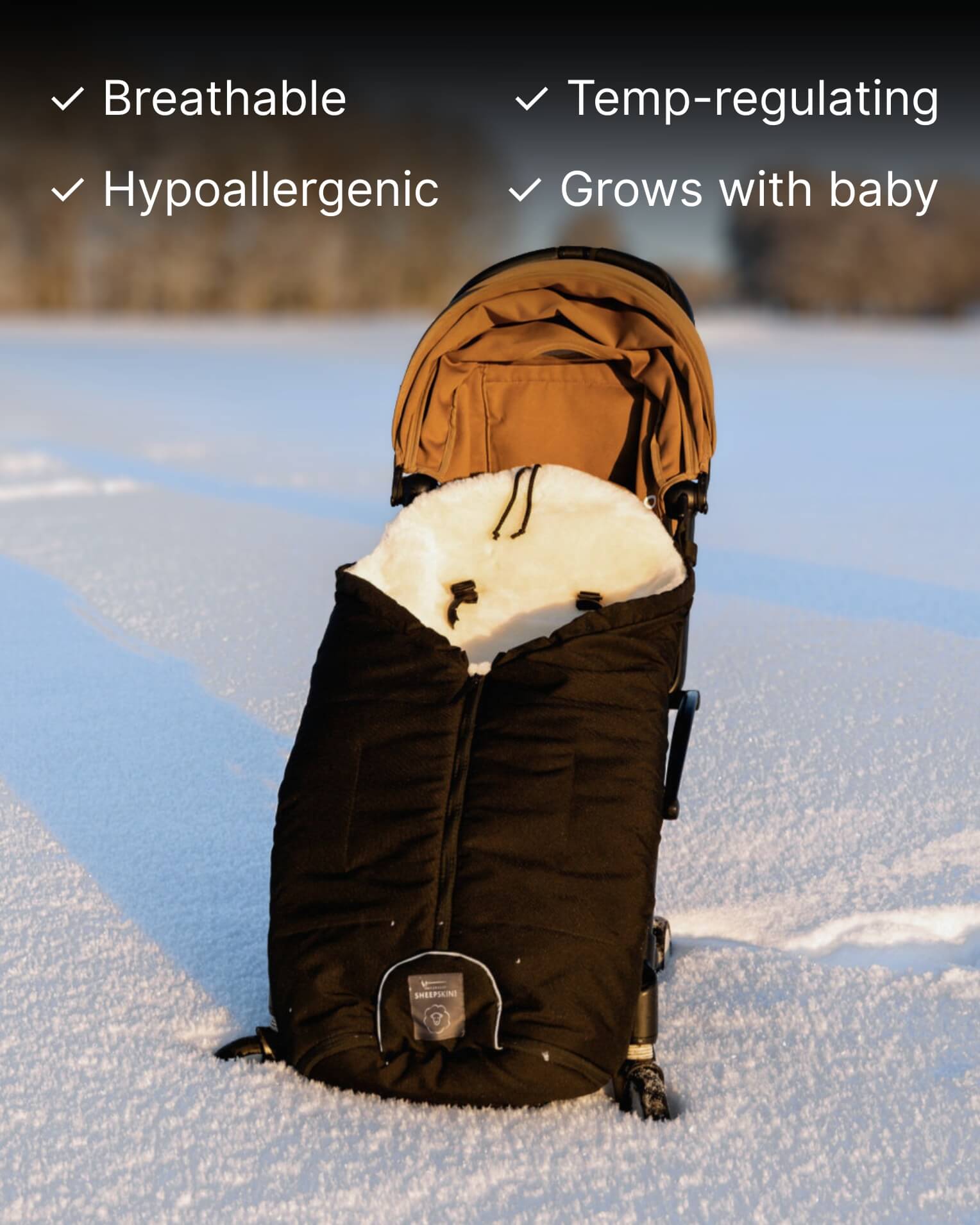 Baby stroller with a black footmuff in show