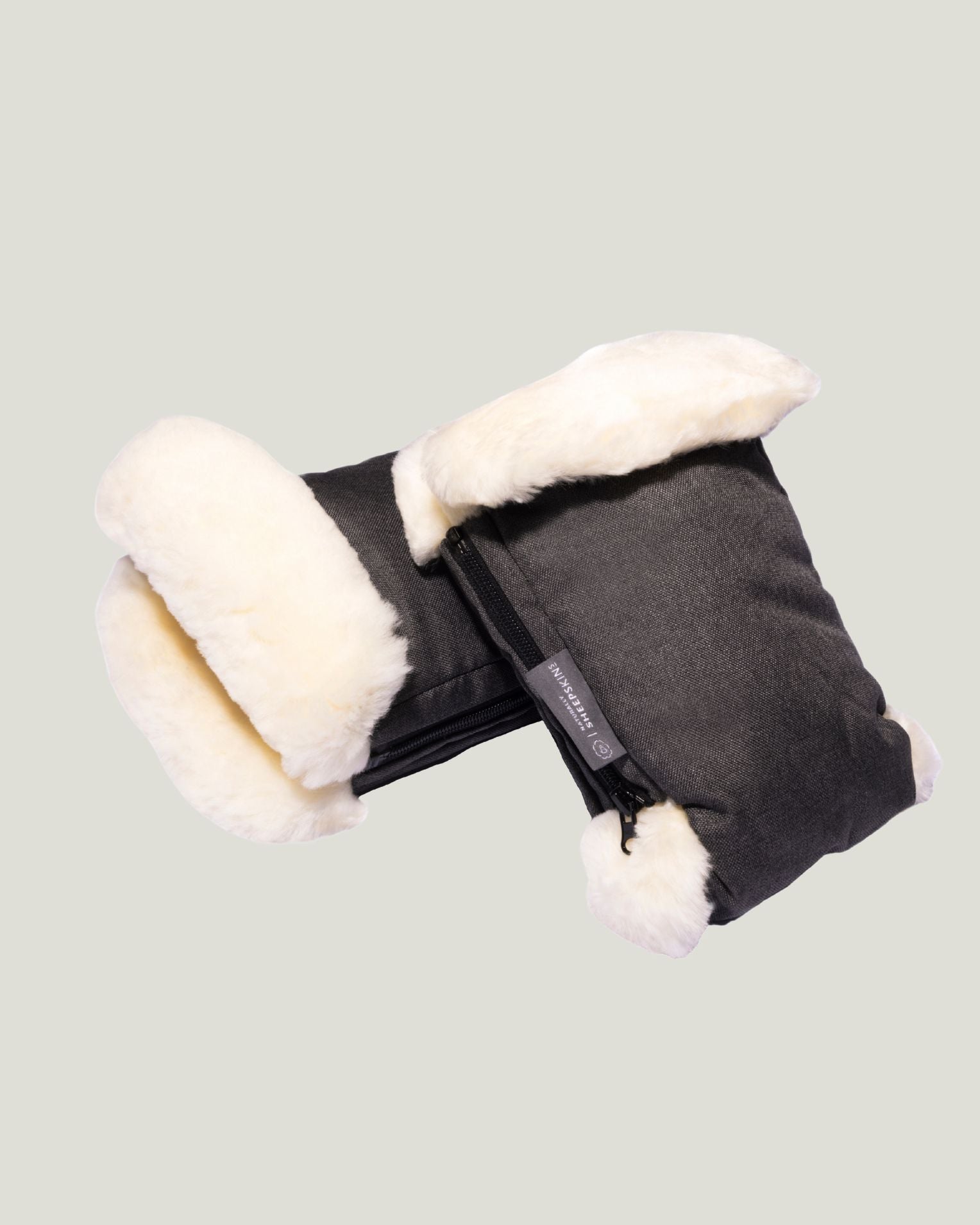 Grey sheepskin mittens stacked