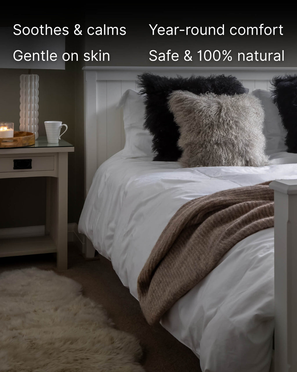 Bedroom with a bed featuring mongolian sheepskin pillows and a blanket.
