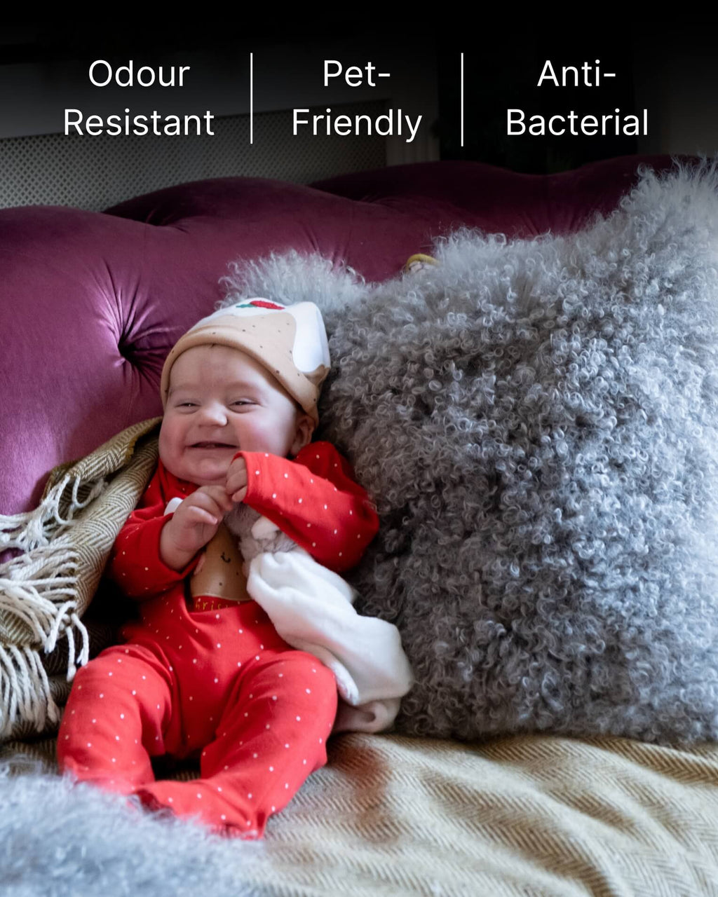 Baby with grey mongolian sheepskin pillow