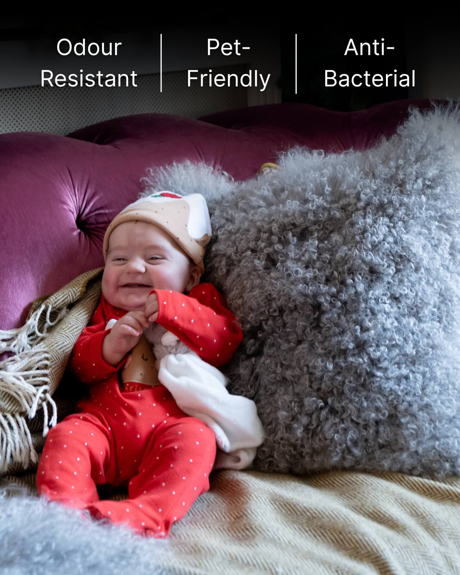 Baby with grey mongolian sheepskin pillow