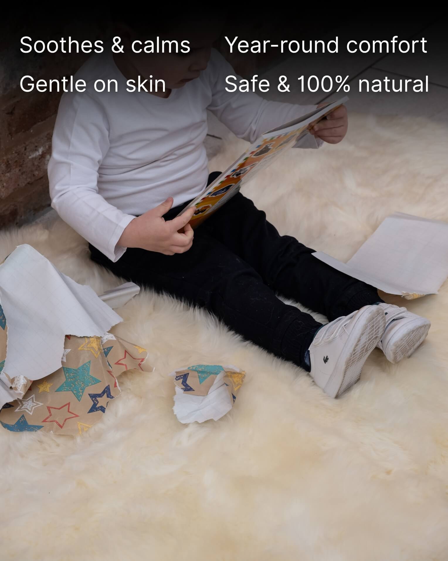 Kid sitting on White Quad Long Sheepskin Rug