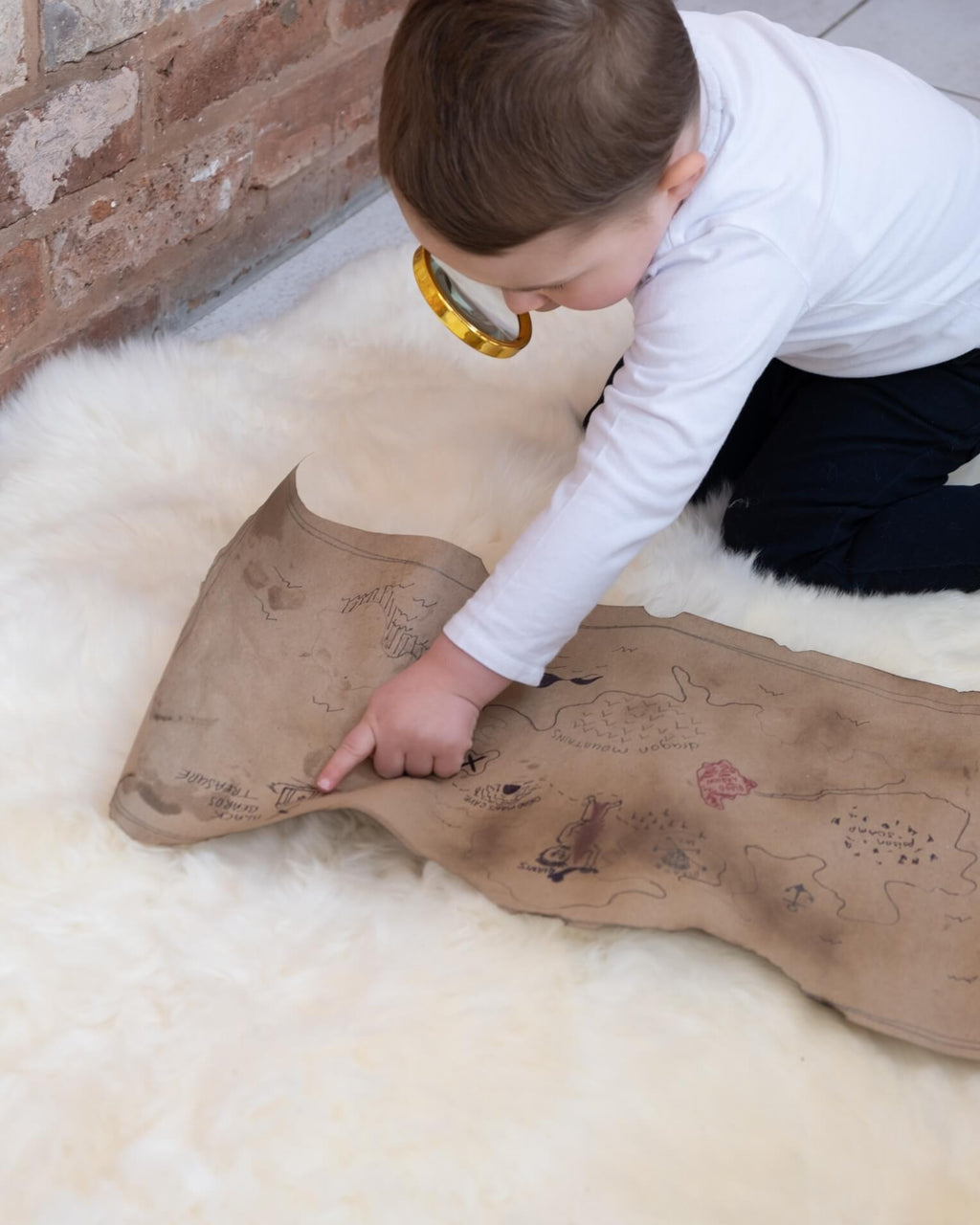 kid playing on White Quad Long Sheepskin Rug