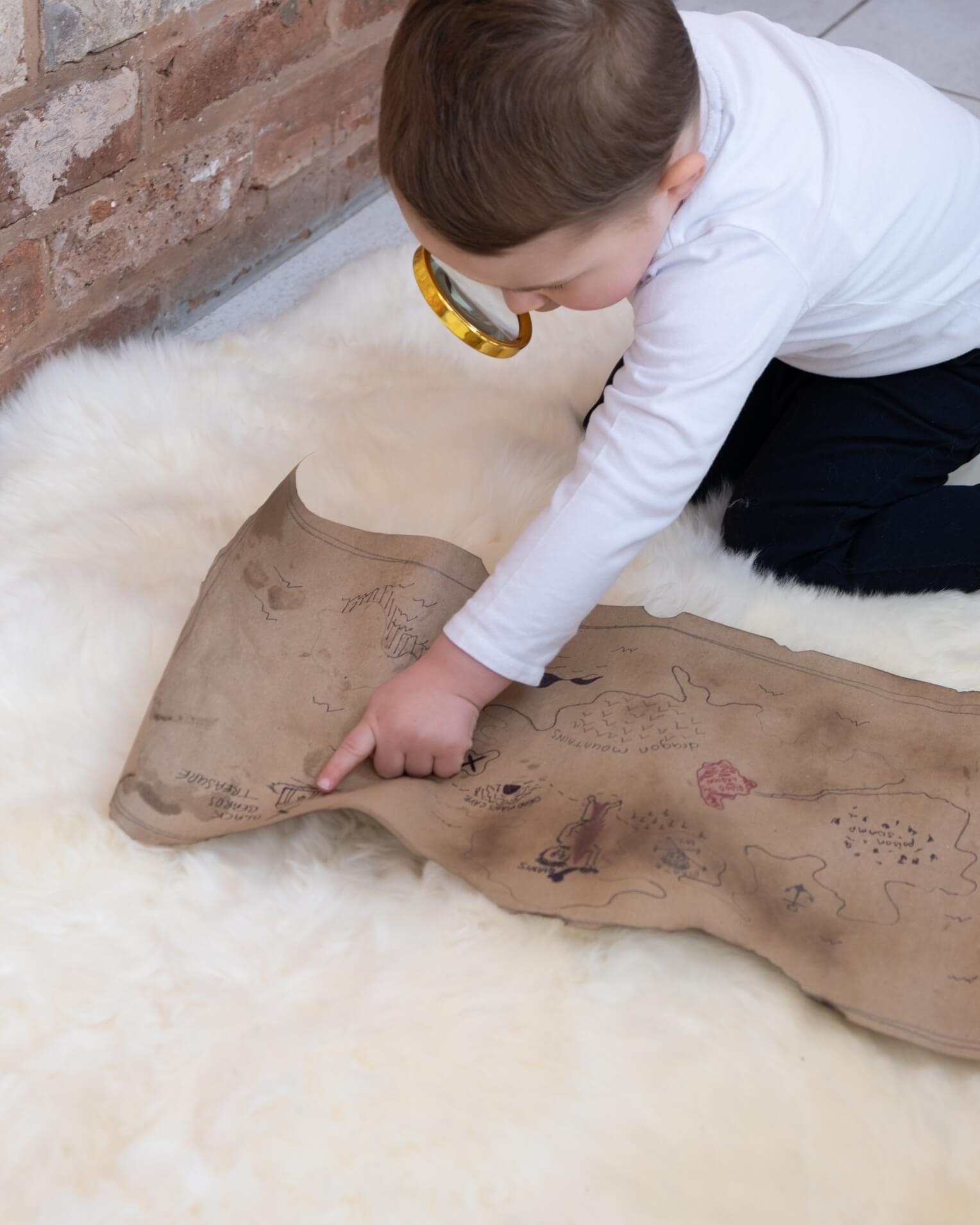 kid playing on White Quad Long Sheepskin Rug