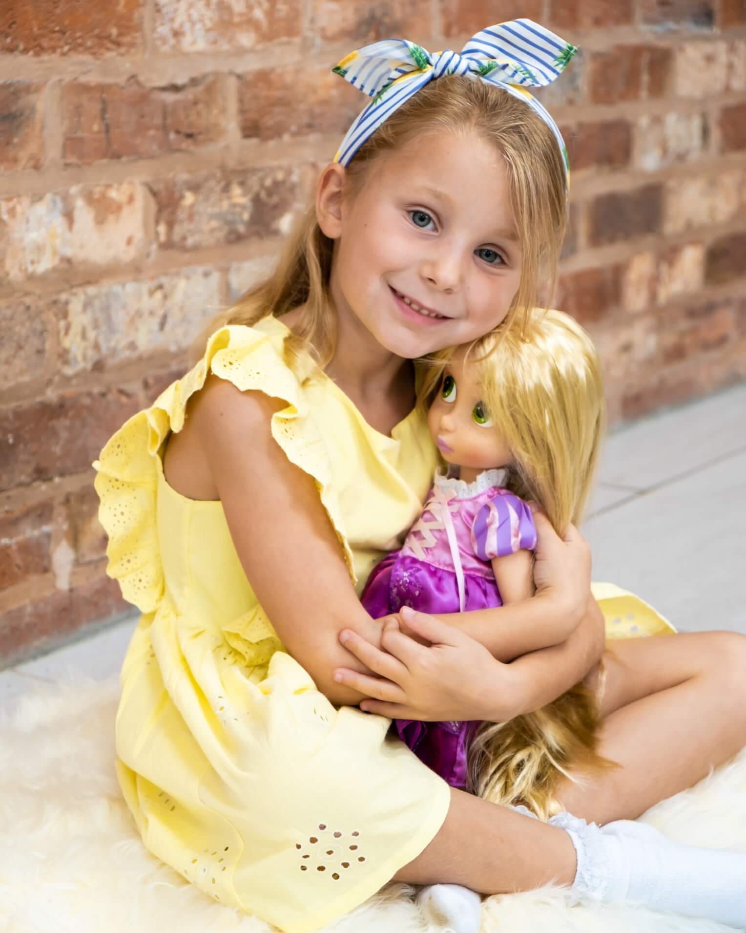 Child sitting on Ivory Single Sheepskin rug