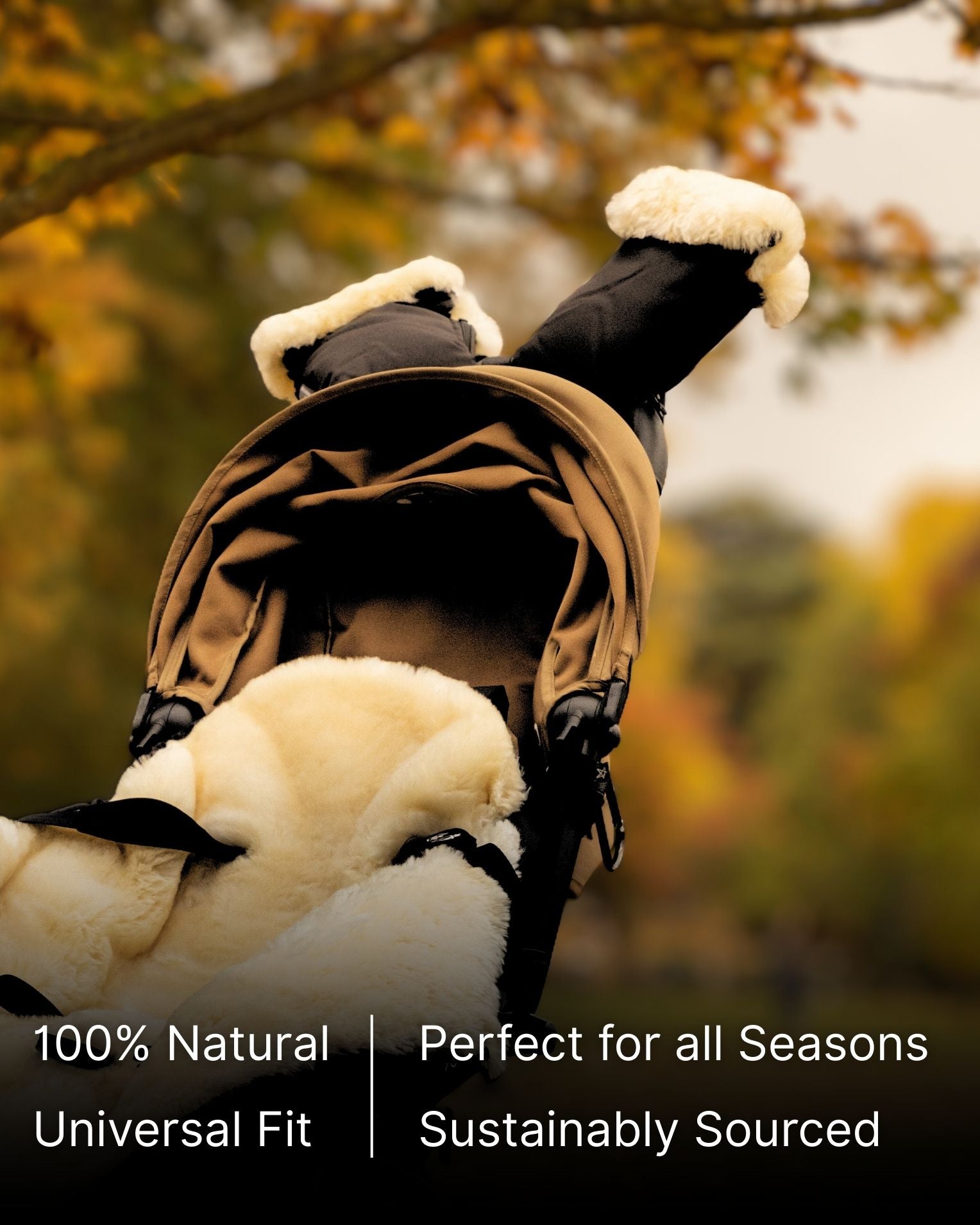 Black sheepskin mittens attached to stroller in pack