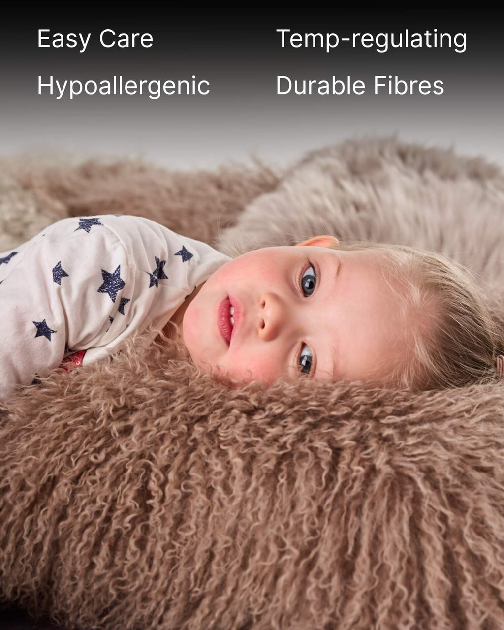 Mocha mongolian sheepskin pillow with kid laying on it