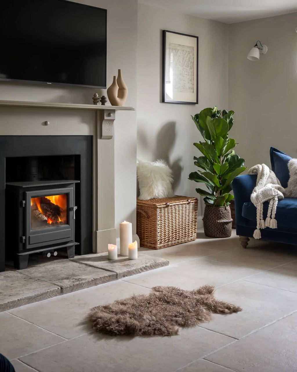 Mocha Mongolian Sheepskin Rug in front of fireplace