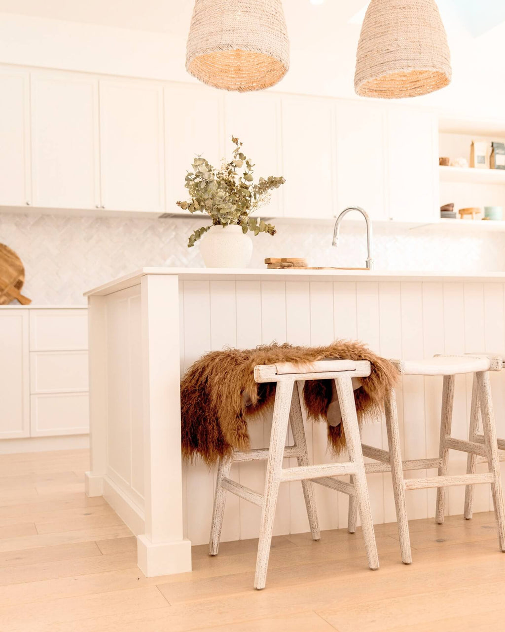 Mocha Mongolian Sheepskin Rug draped on chair