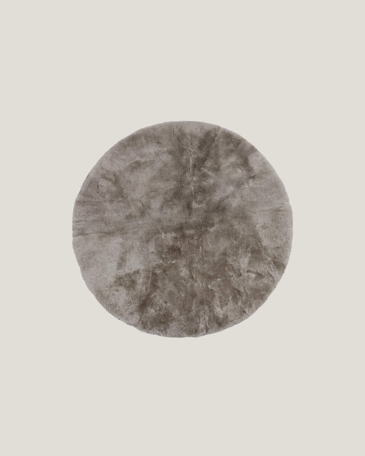 Product photo of a round tapue sheepskin playmat 