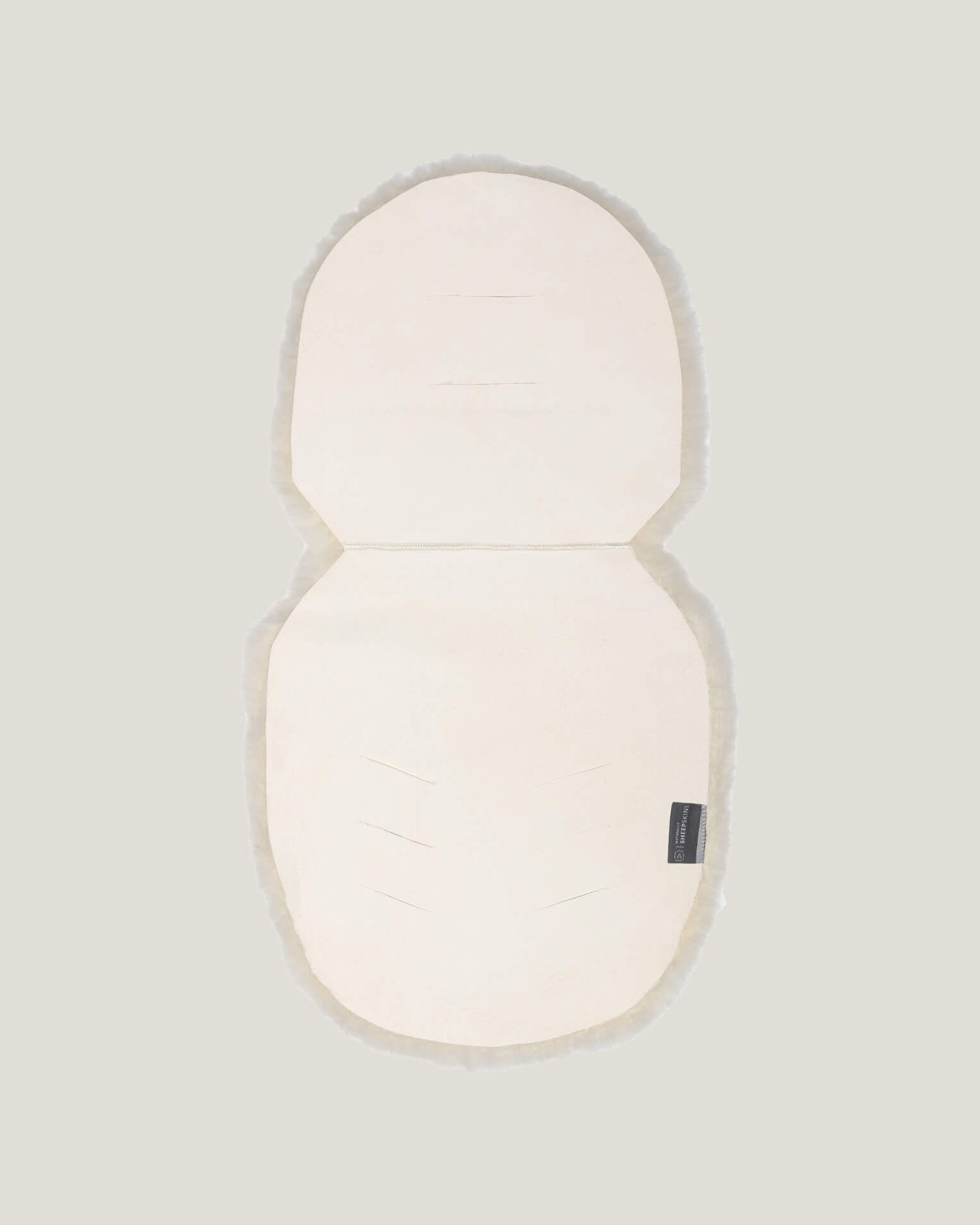 Back detail of sheepskin pram liner