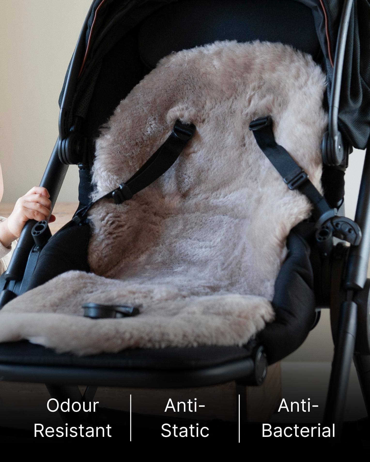 Baby seat cover with anti-odor, anti-static, and antibacterial properties in a stroller.