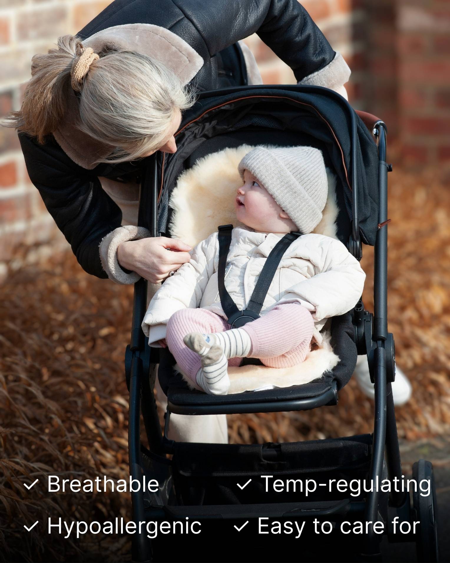 Woman adjusting a baby in a stroller