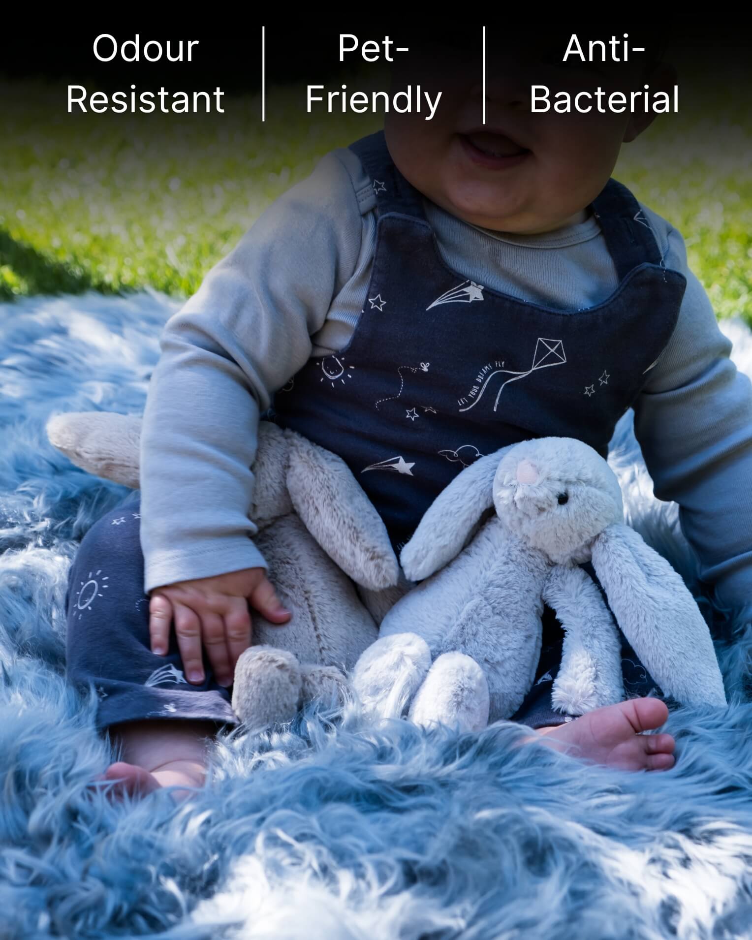 Baby sitting on Steel Grey Single Sheepskin rug