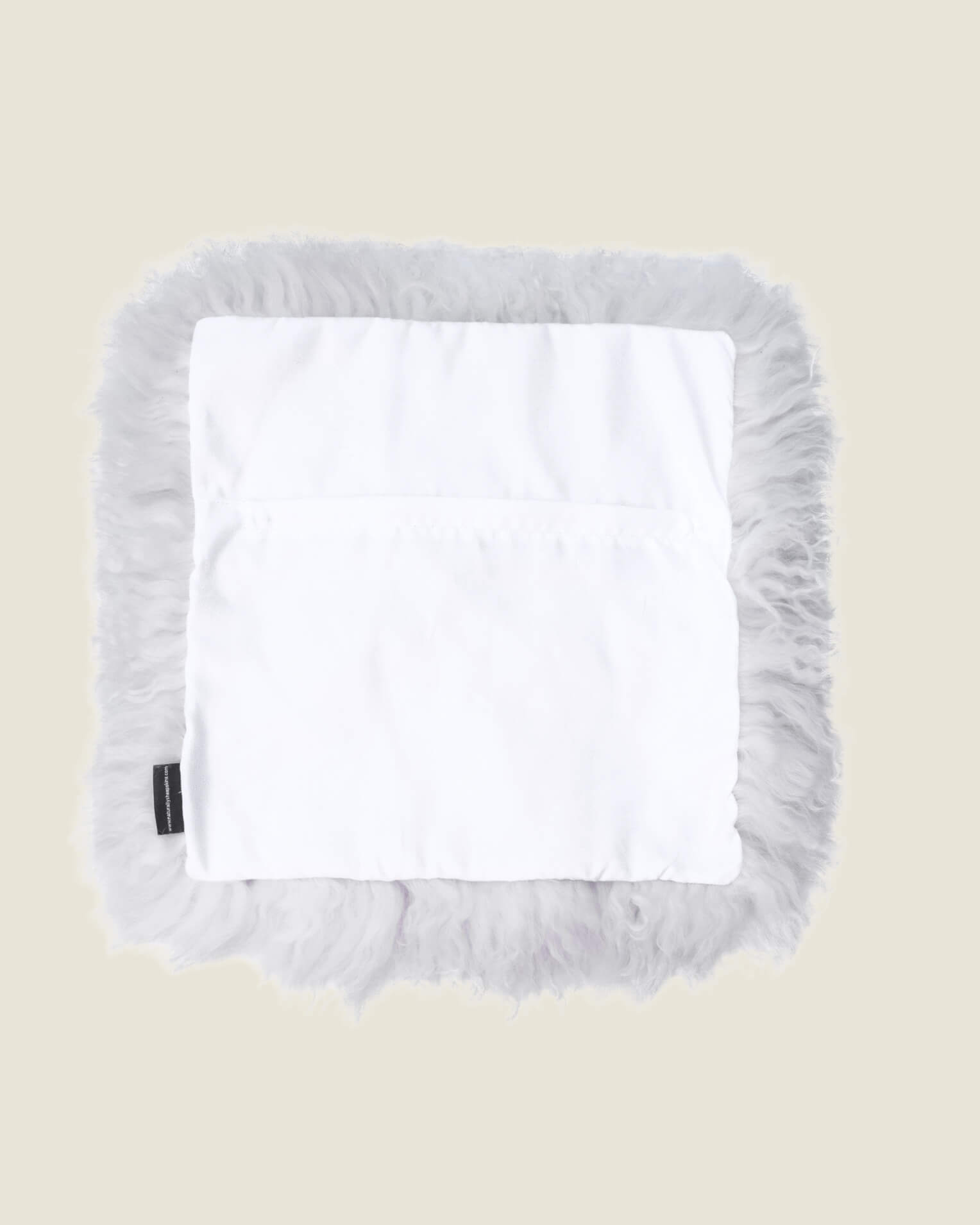 White mongolian sheepskin pillow back
