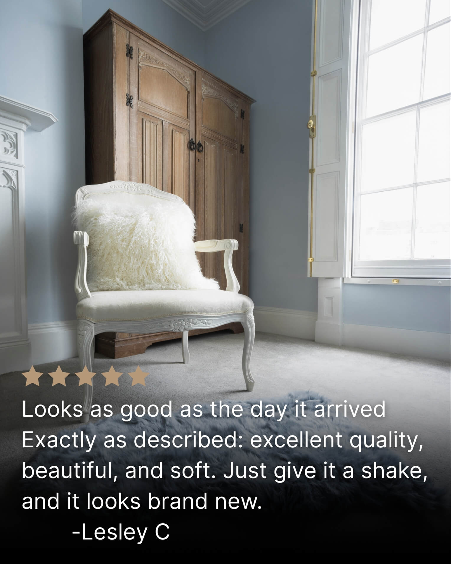 White mongolian sheepskin pillow on single white chair