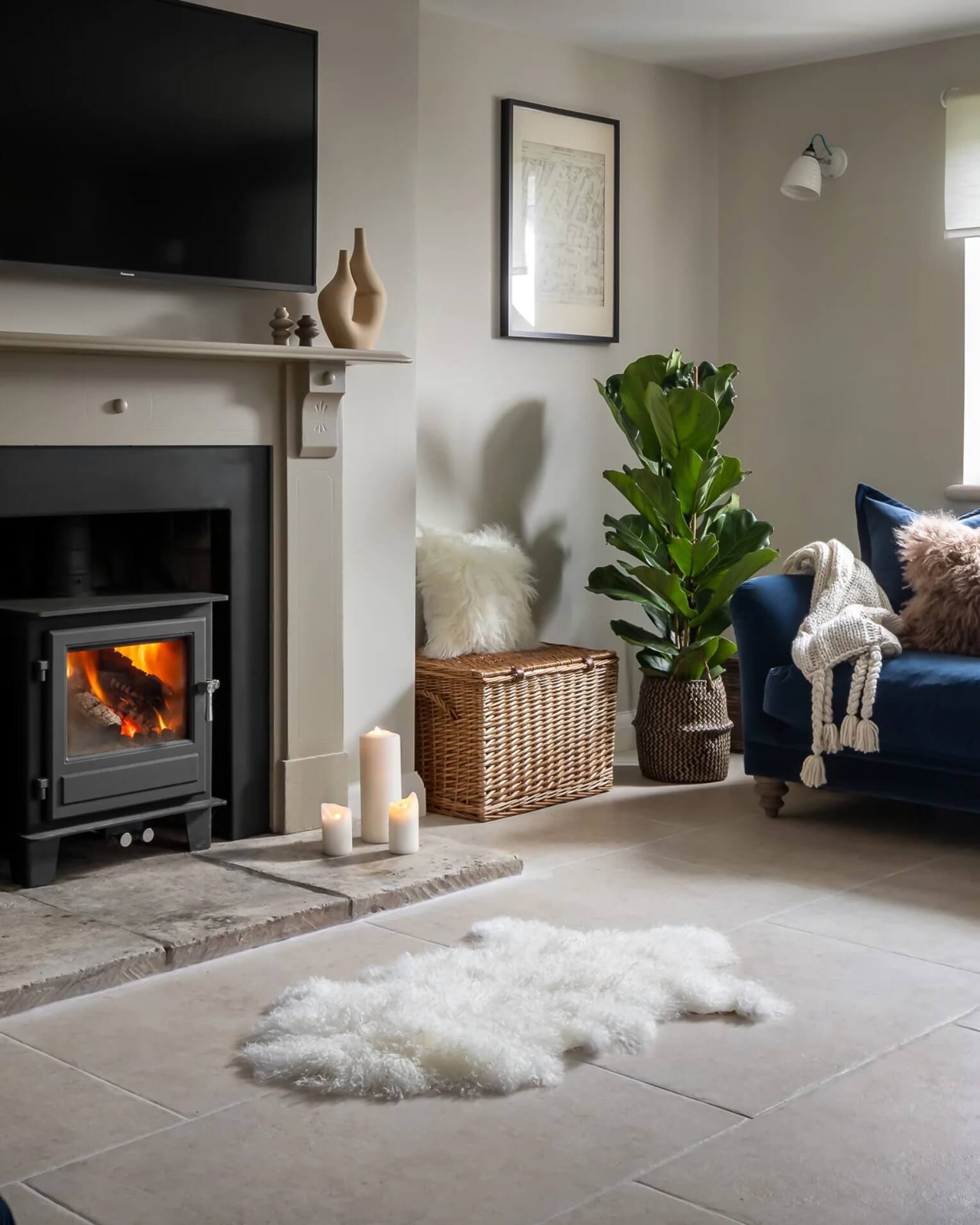 Ivory Mongolian Sheepskin Rug in front of fireplace