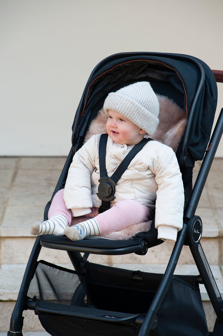 rose gold pink sheepskin pram liner in pushchair