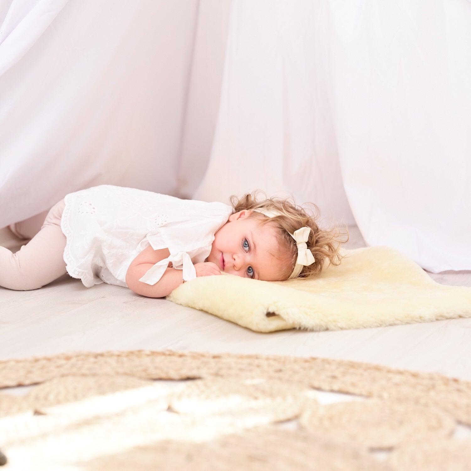 Sheepskin Baby Rug - Naturally Sheepskins baby lying on rug