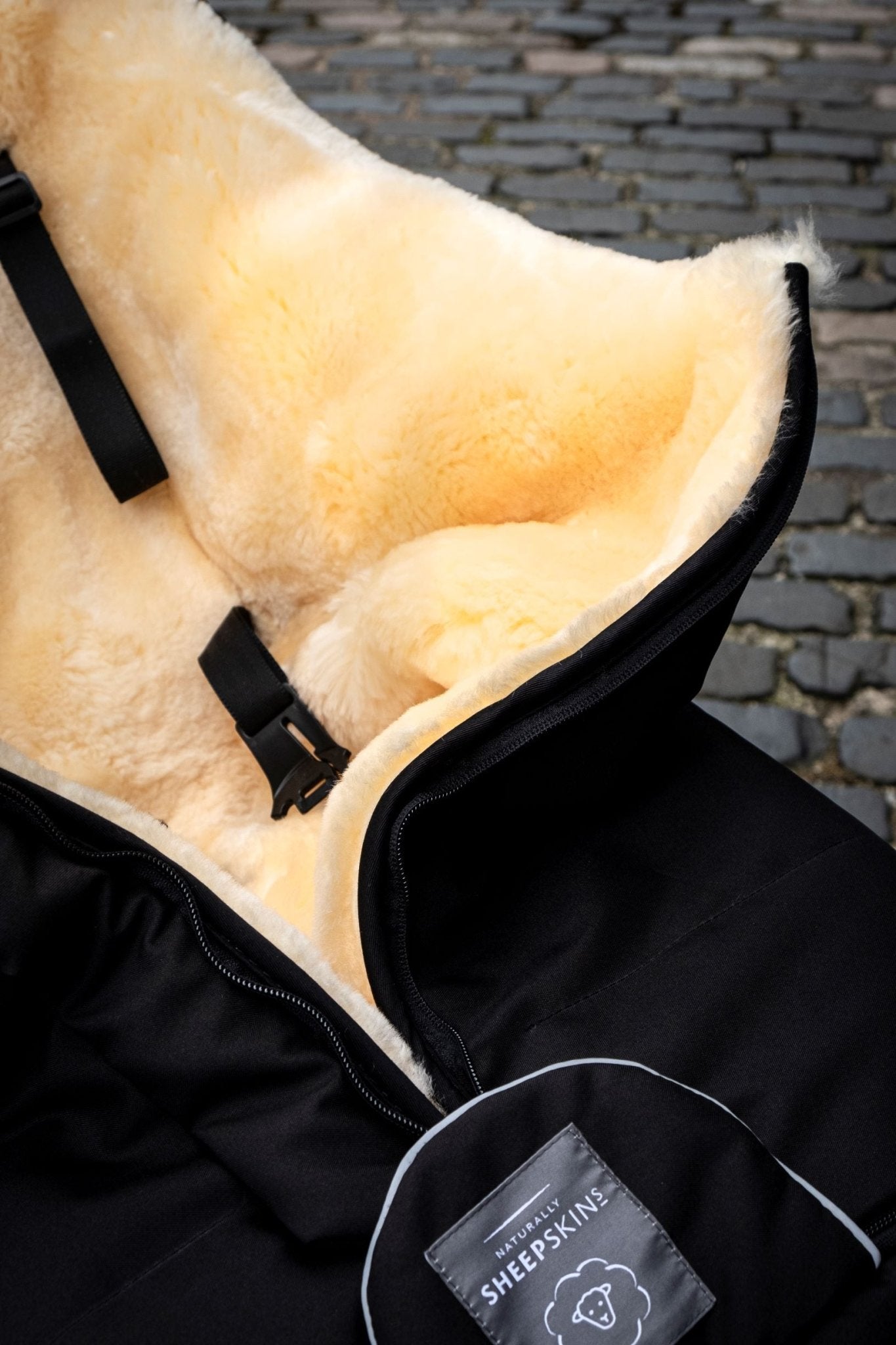 Sheepskin Footmuff Black corner shot of sheepskin
