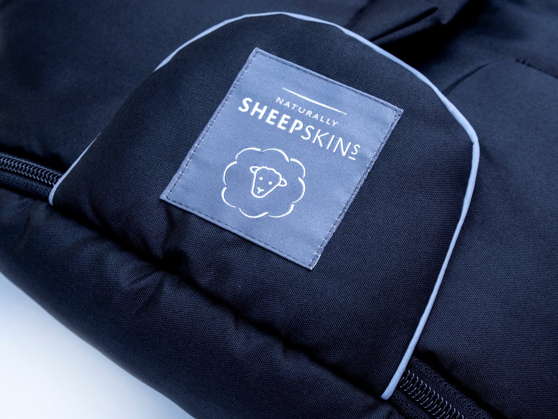 Sheepskin Footmuff Black close up logo